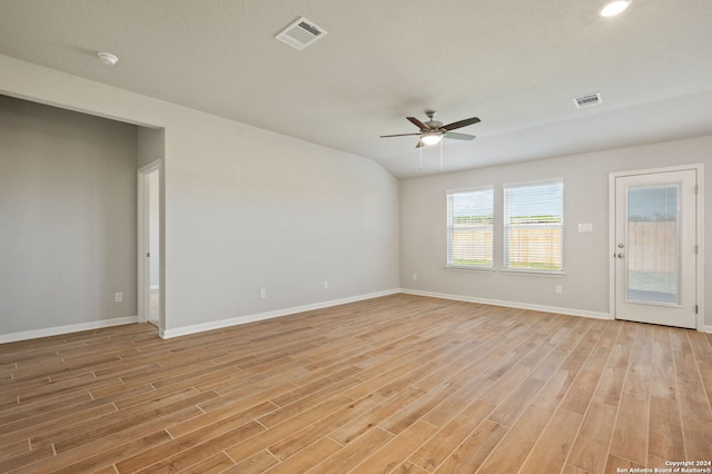 spare room featuring a textured ceiling, light hardwood / wood-style flooring, and ceiling fan