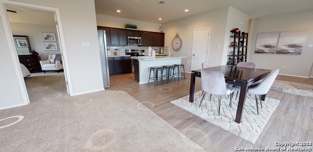 dining room featuring light hardwood / wood-style flooring