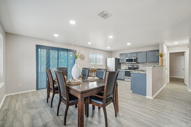 dining area with light hardwood / wood-style flooring