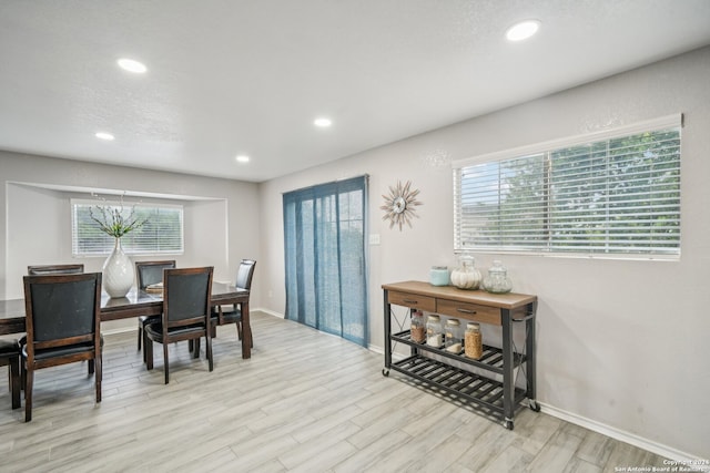 dining area with light hardwood / wood-style floors