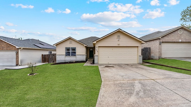 ranch-style house featuring a garage and a front lawn