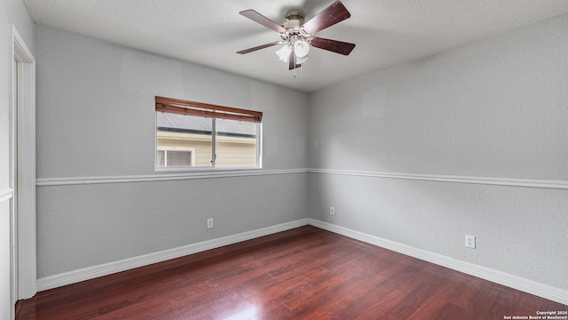 empty room with hardwood / wood-style floors and ceiling fan