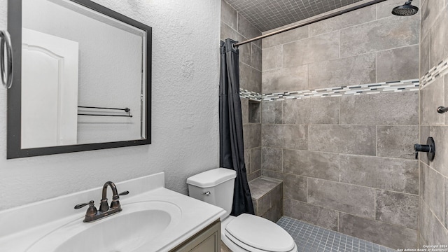 bathroom with toilet, vanity, and curtained shower