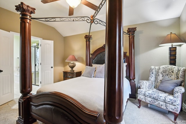 bedroom featuring vaulted ceiling, light carpet, ceiling fan, and ensuite bathroom