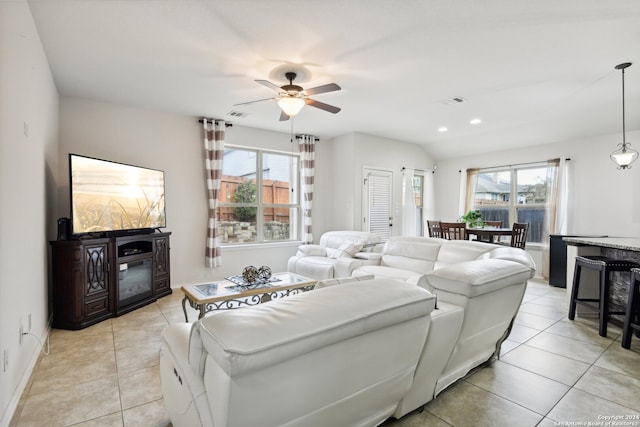 living room with plenty of natural light, light tile patterned flooring, and ceiling fan