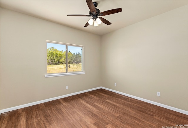 empty room featuring hardwood / wood-style flooring and ceiling fan