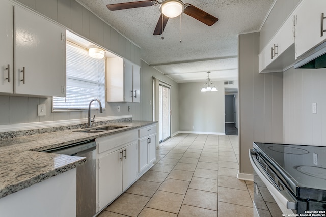 kitchen featuring white cabinets, hanging light fixtures, sink, light tile patterned flooring, and electric range