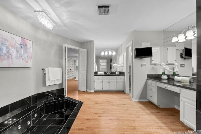 bathroom featuring vanity and hardwood / wood-style floors