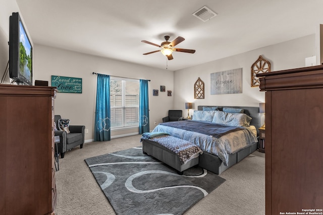 bedroom with light colored carpet and ceiling fan