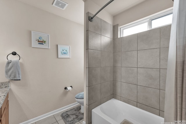 full bathroom featuring toilet, shower / bath combo, vanity, and tile patterned flooring