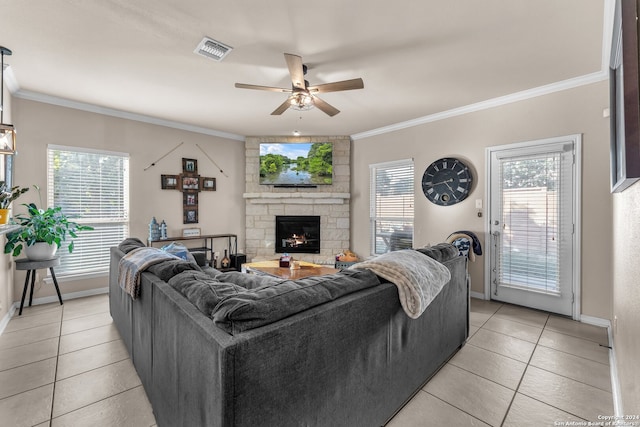 living room with ornamental molding and plenty of natural light