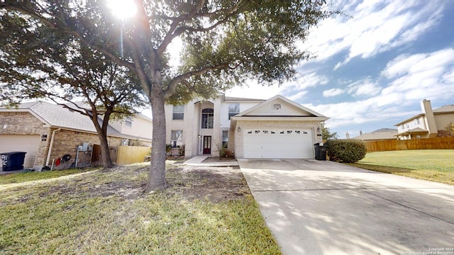 view of front of house with a garage and a front lawn