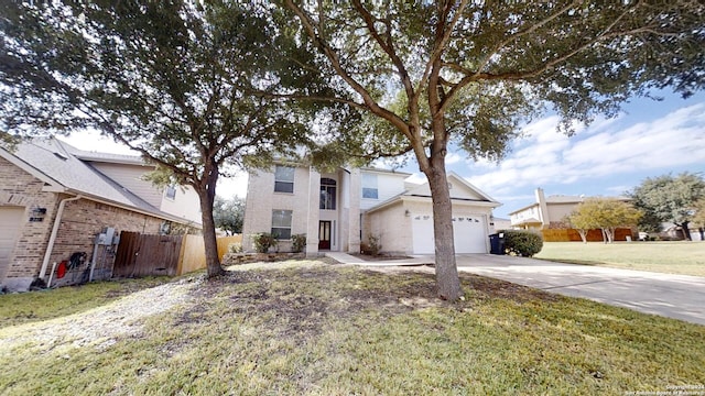 view of front of property with a garage and a front yard