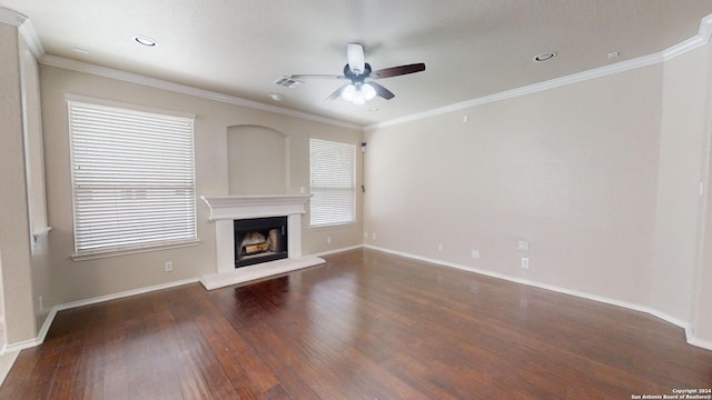 unfurnished living room with dark hardwood / wood-style flooring, ceiling fan, and crown molding