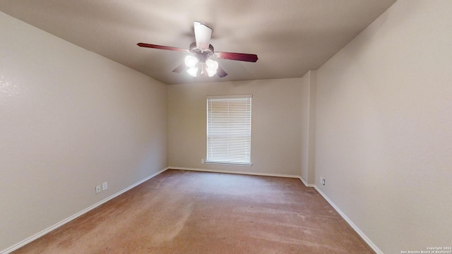 carpeted empty room with ceiling fan