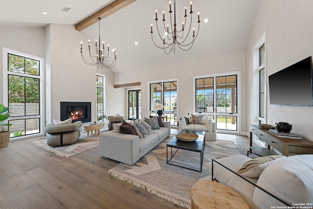 706 W Creek, Fredericksburg, TX 78624 - living room with beamed ceiling, high vaulted ceiling, a notable chandelier, and hardwood / wood-style flooring