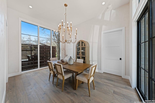 706 W Creek, Fredericksburg, TX 78624 - dining space featuring hardwood / wood-style floors and an inviting chandelier