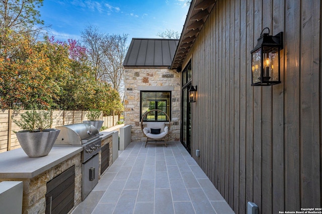 706 W Creek, Fredericksburg, TX 78624 - view of patio / terrace with grilling area and exterior kitchen