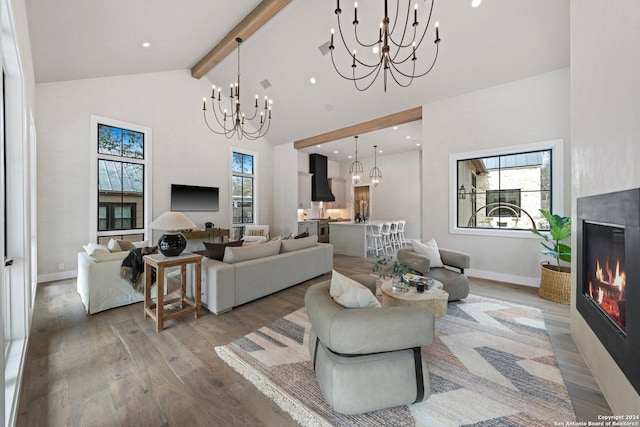 706 W Creek, Fredericksburg, TX 78624 - living room featuring high vaulted ceiling, beam ceiling, wood-type flooring, and a tile fireplace