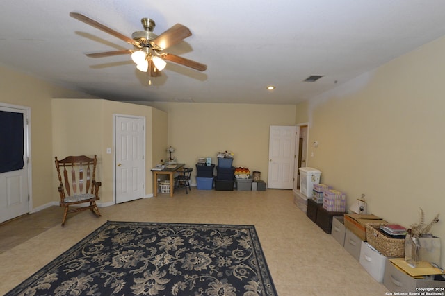 interior space with ceiling fan