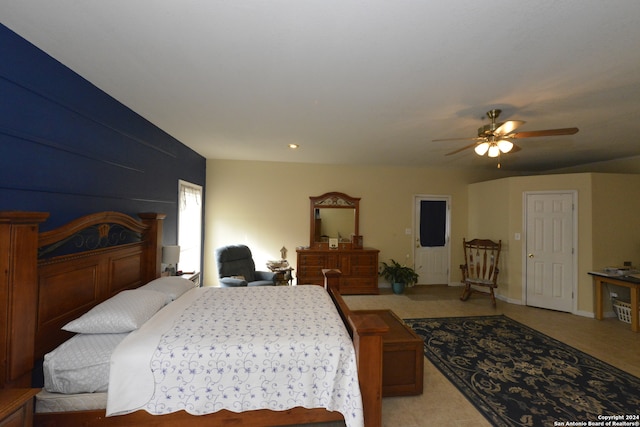 bedroom featuring ceiling fan and light colored carpet