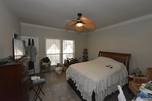 bedroom featuring ceiling fan and ornamental molding