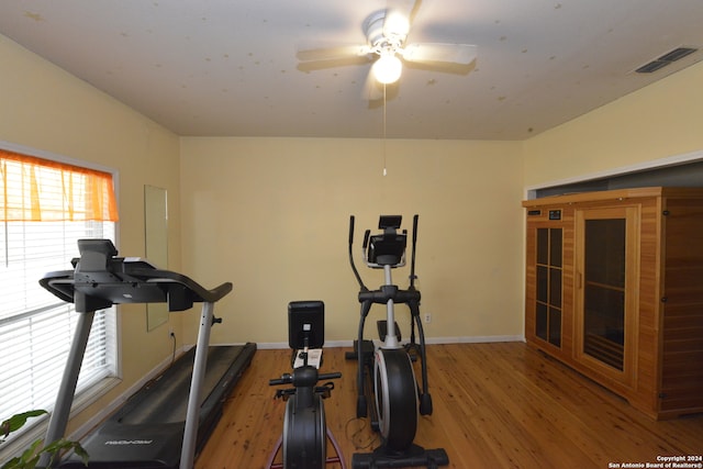 exercise area featuring light hardwood / wood-style floors and ceiling fan