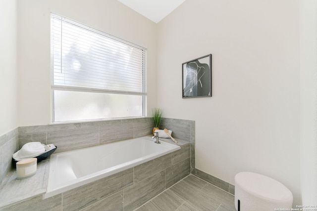 bathroom with tiled tub