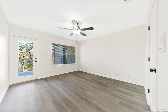 unfurnished room with ceiling fan and hardwood / wood-style flooring