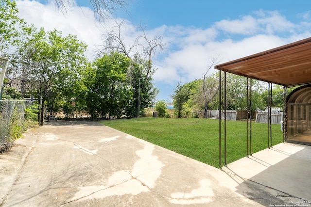 view of yard with a carport