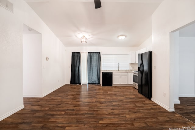 kitchen with sink, black appliances, dark hardwood / wood-style flooring, white cabinets, and vaulted ceiling