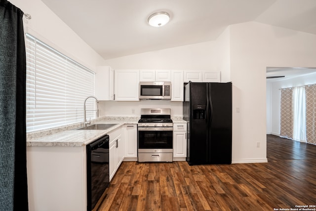 kitchen with dark hardwood / wood-style floors, sink, black appliances, and vaulted ceiling