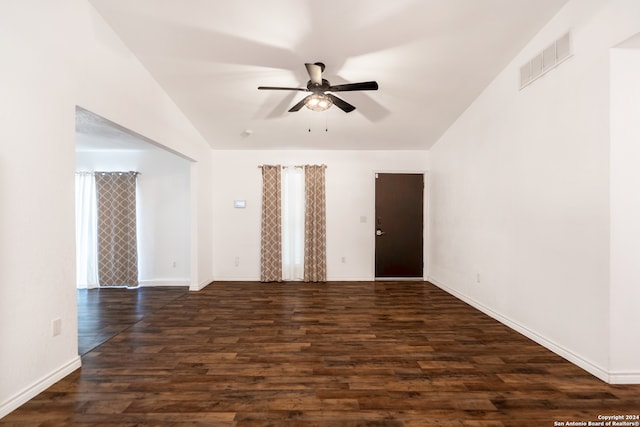 unfurnished room featuring dark wood-type flooring, lofted ceiling, and ceiling fan