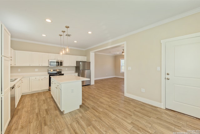 kitchen with white cabinetry, appliances with stainless steel finishes, pendant lighting, a center island, and light wood-type flooring