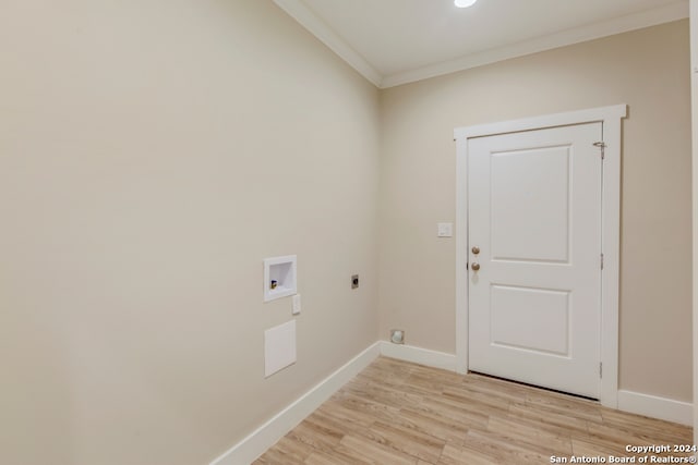 laundry area with hookup for an electric dryer, hookup for a washing machine, crown molding, and light hardwood / wood-style flooring