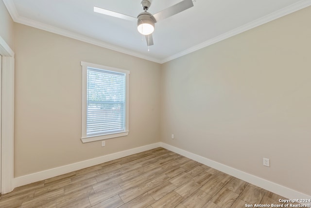 unfurnished room featuring light hardwood / wood-style floors, ceiling fan, and crown molding