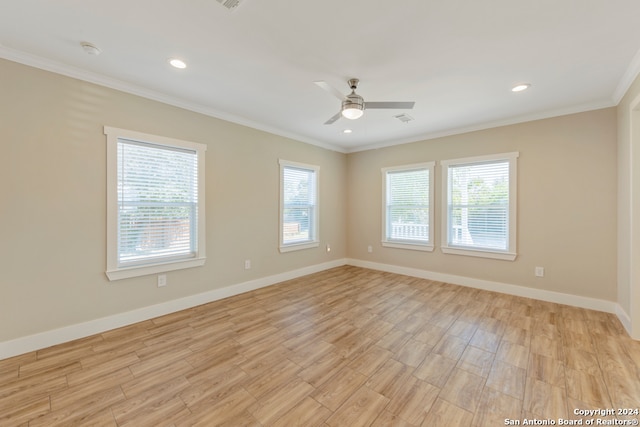 unfurnished room with ceiling fan, light hardwood / wood-style floors, and crown molding