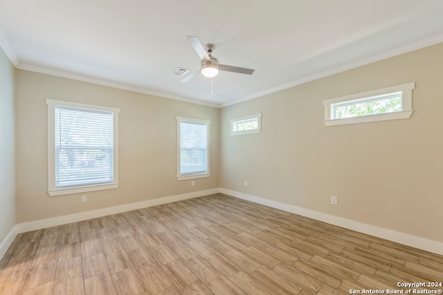 empty room featuring light hardwood / wood-style floors, ceiling fan, and crown molding