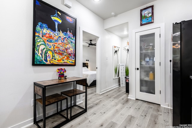 corridor featuring light hardwood / wood-style floors