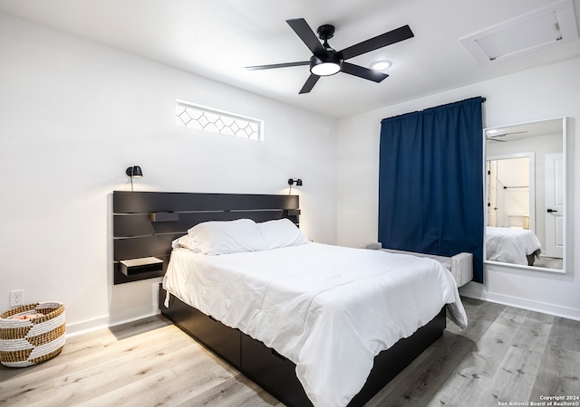 bedroom with hardwood / wood-style floors and ceiling fan