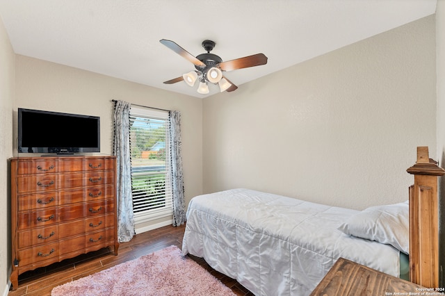 bedroom featuring ceiling fan and dark hardwood / wood-style floors