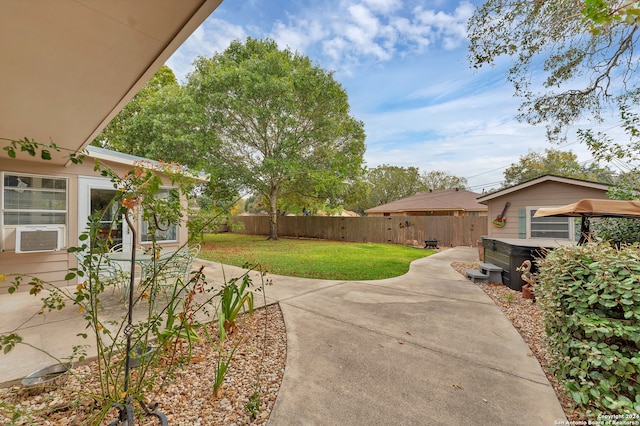 view of yard featuring cooling unit and a patio