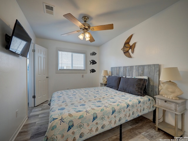 bedroom featuring hardwood / wood-style floors and ceiling fan