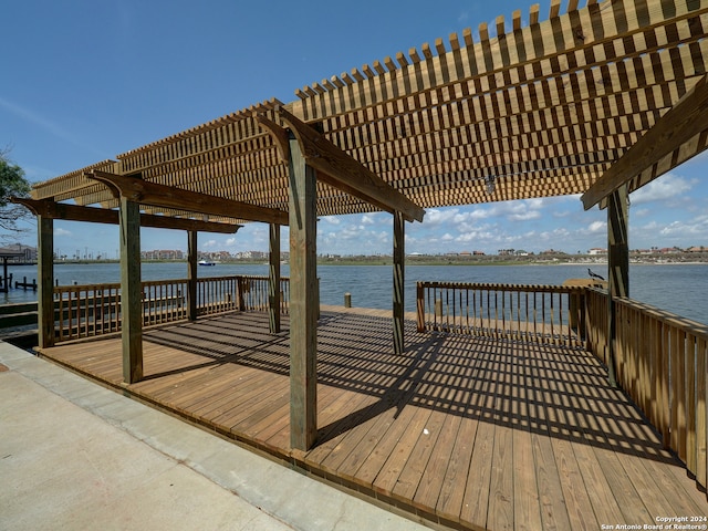 view of dock with a pergola and a deck with water view