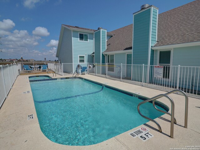 view of pool with a water view