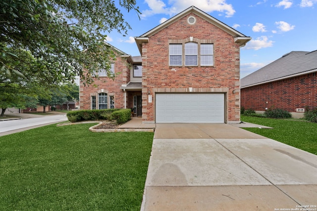 view of property with a garage and a front yard