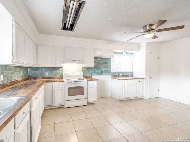 kitchen with butcher block counters, white cabinetry, decorative backsplash, and white electric range