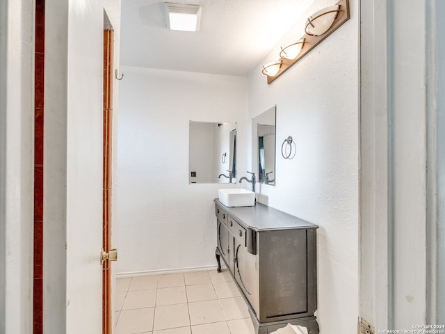 bathroom featuring tile patterned flooring and vanity