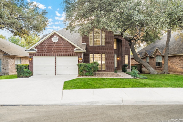 front of property with a garage and a front yard