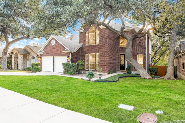 front of property featuring a garage and a front lawn